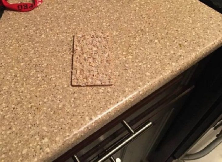 Photographs that will make you look twice or do a double take, Piece of crisp bread same color as the kitchen counter