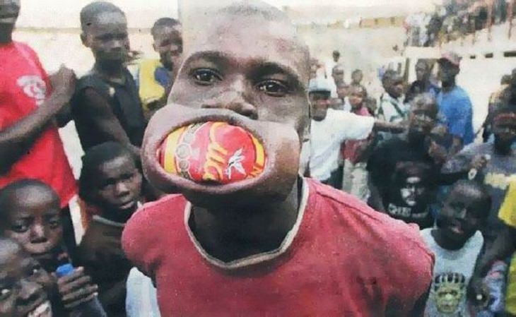 Hilarious photos showing things that can happen only in Africa, Man with drink can in his mouth