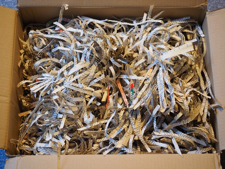 Household items that should not have the vacuum cleaner used on them, Cardboard box filled with shredded paper