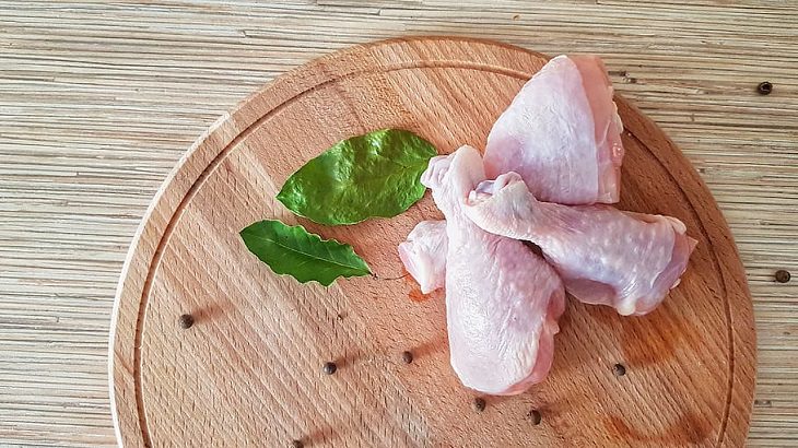 Food safety facts and myths you need to know about, 3 raw chicken legs on a cutting board