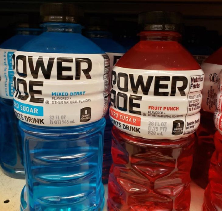 Downsizing and labelling marketing ploys done to trick Customers by big companies, Two different flavors of powerade bottles that are different sizes