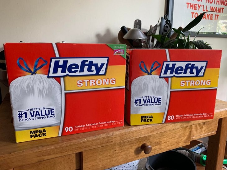 Downsizing and labelling marketing ploys done to trick Customers by big companies, Two hefty bags mega packs with 90 bags and 80 bags respectively
