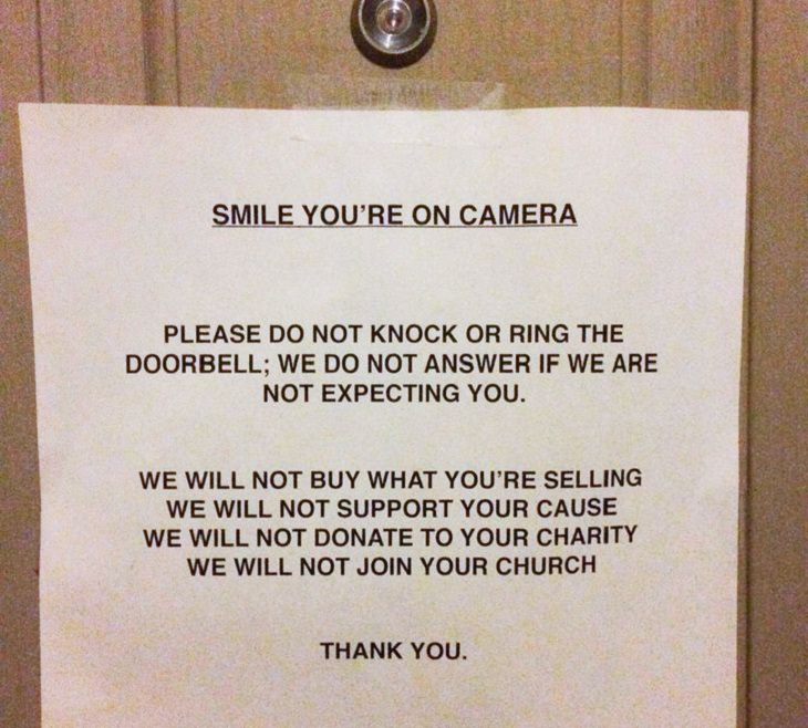 Hilarious “do not disturb” and “do not enter” signs, signed taped to door with heading "smile you're on camera"