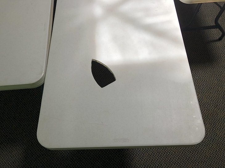 Hilarious ironing fails and mistakes made with hot clothes iron, Plastic table with clean iron-shaped hole in it