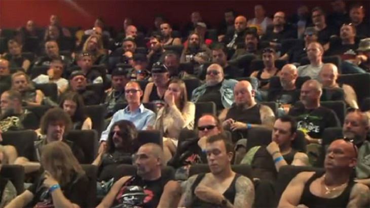 Amazing and insightful social experiments, Couple sitting in a theater surrounded by bikers for Carlsberg social experiment