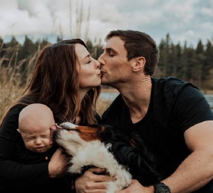Beautiful pictures of touching, cute, and warm moments, Couple kissing while dog licks baby