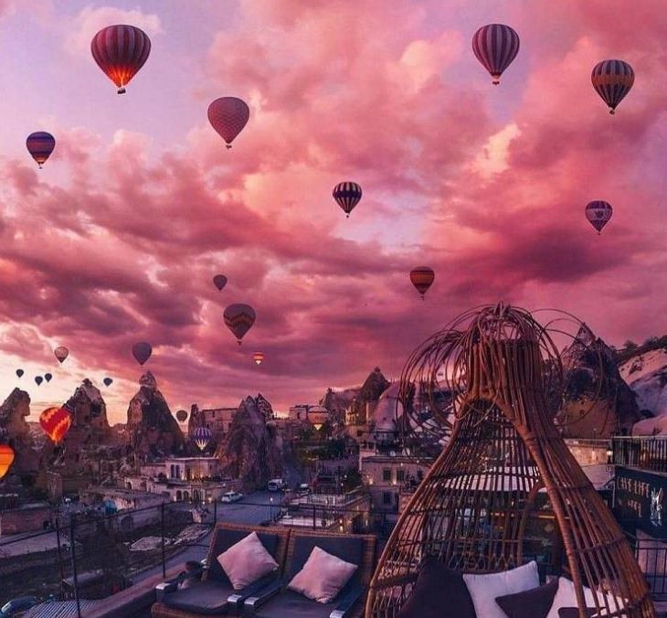 Beautiful pictures of touching, cute, and warm moments, Pink and purple sky filled with hot air balloons