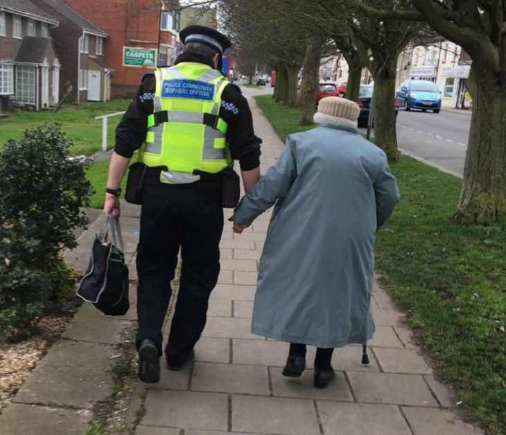 Beautiful pictures of touching, cute, and warm moments, Traffic worker helping old lady walk