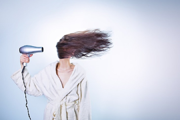 Weird and bizarre facts about the human body, Woman using a blow dryer to blow her hair over her face