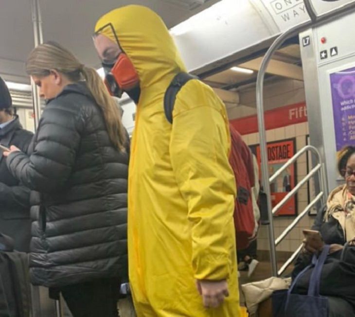 Hilarious photos of strange masks spotted on the subway, Man wearing a hazmat suit on the subway