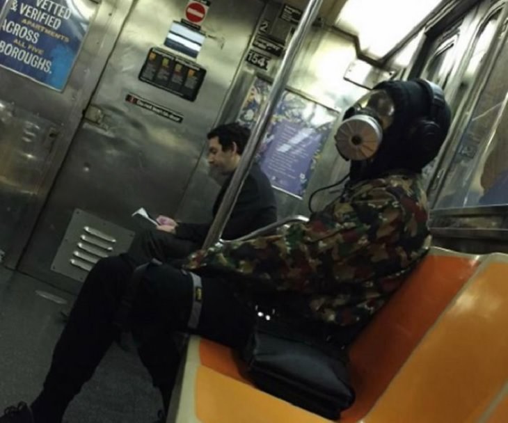 Hilarious photos of strange masks spotted on the subway, Man wearing gas mask on the subway