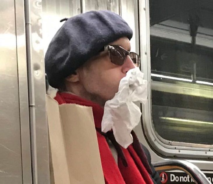 Hilarious photos of strange masks spotted on the subway, Woman on subway with tissue on her face