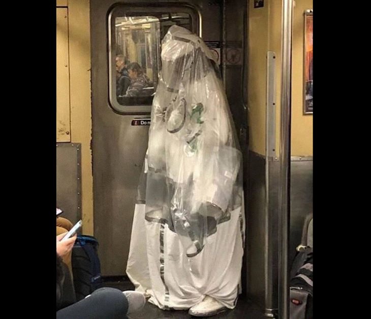 Hilarious photos of strange masks spotted on the subway, Person wrapped in shower curtain on the subway