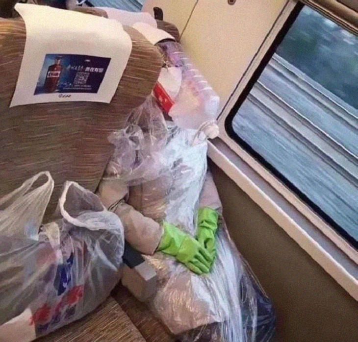 Hilarious photos of strange masks spotted on the subway, Person covered in plastic wrap and large water bottle on their heads