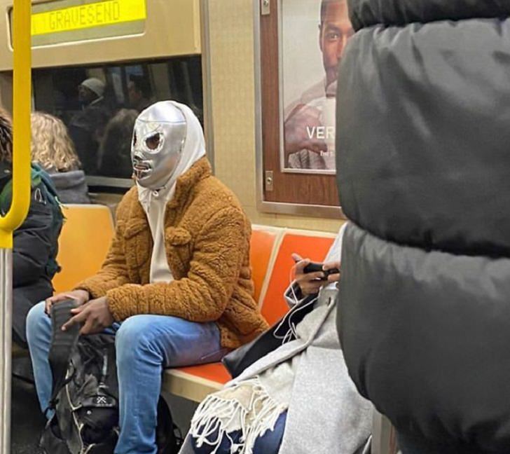 Hilarious photos of strange masks spotted on the subway, Man wearing silver mask covering entire face