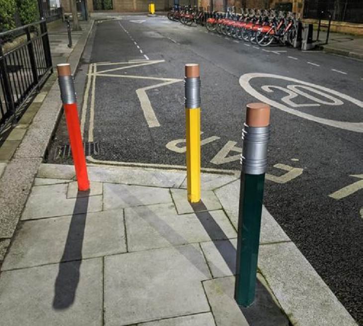 Smart, beautiful, innovative, and unique designs found in cities around the world, Pencil-shaped bollards (traffic posts) outside of a school in Gloucestershire, England