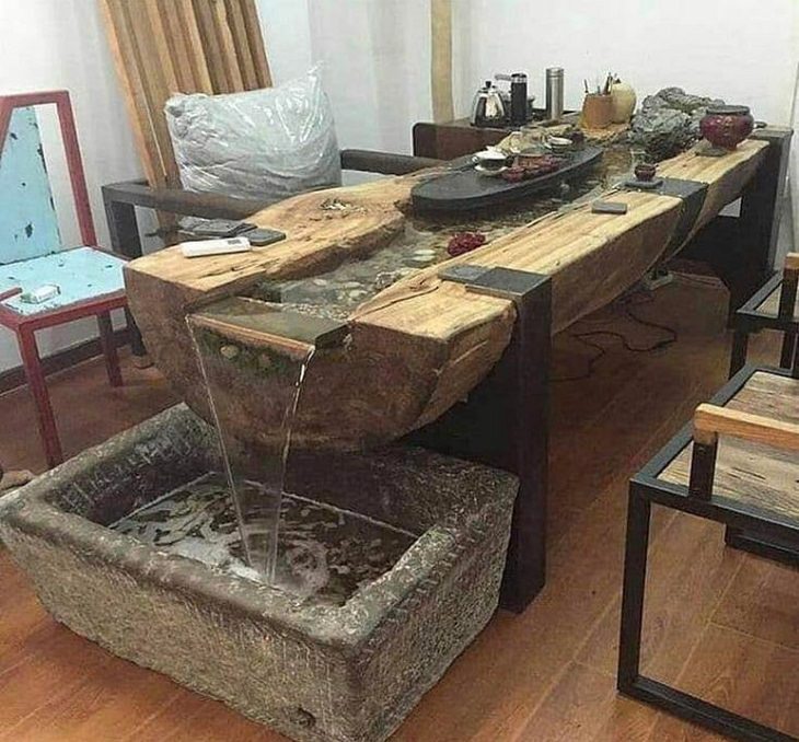Hilarious bad DIY projects that failed, Table with a stream of water falling into a trough