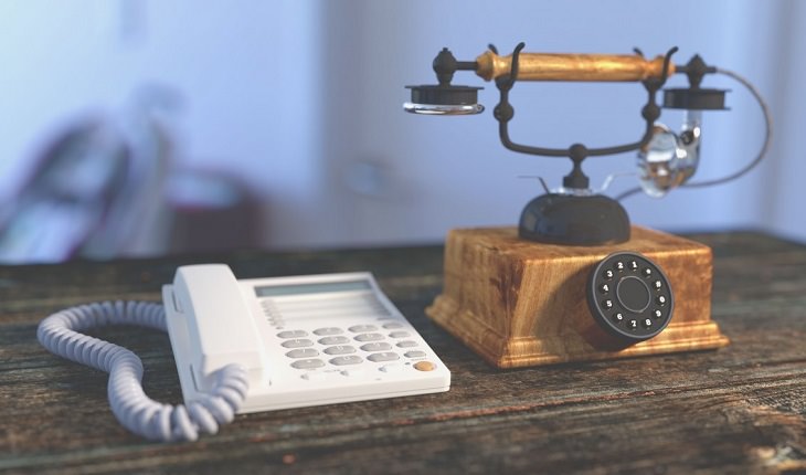 5 old rules of etiquette that don’t apply anymore, Landline phone and old phone on a table