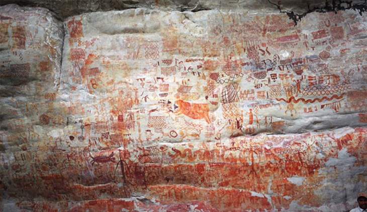 Photographs of cave paintings and rock art on 8 mile cliff in Western Amazon Rainforest called the Sistine Chapel of the Ancients 