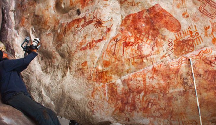 Photographs of cave paintings and rock art on 8 mile cliff in Western Amazon Rainforest called the Sistine Chapel of the Ancients 
