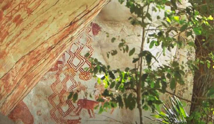 Photographs of cave paintings and rock art on 8 mile cliff in Western Amazon Rainforest called the Sistine Chapel of the Ancients 