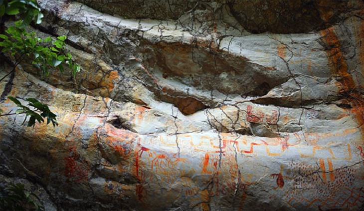 Photographs of cave paintings and rock art on 8 mile cliff in Western Amazon Rainforest called the Sistine Chapel of the Ancients 