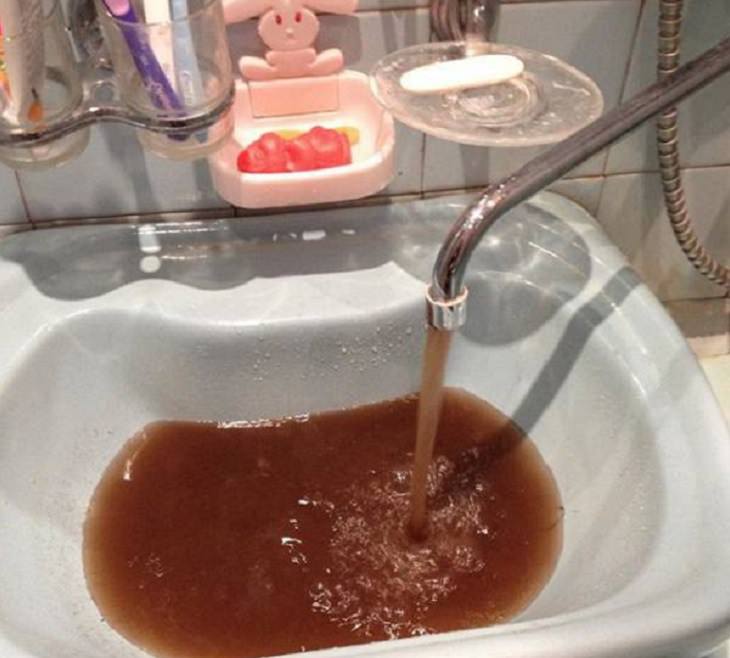 Strange, odd and weird things only found in Russia, sink and faucet with red and brown water