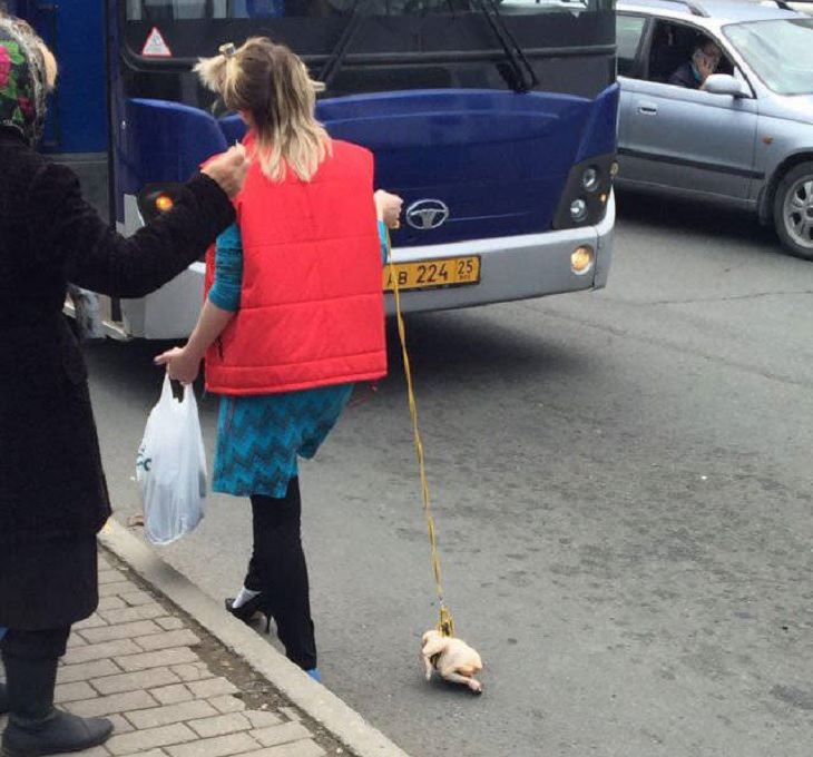Strange, odd and weird things only found in Russia, woman with a raw chicken on a leash