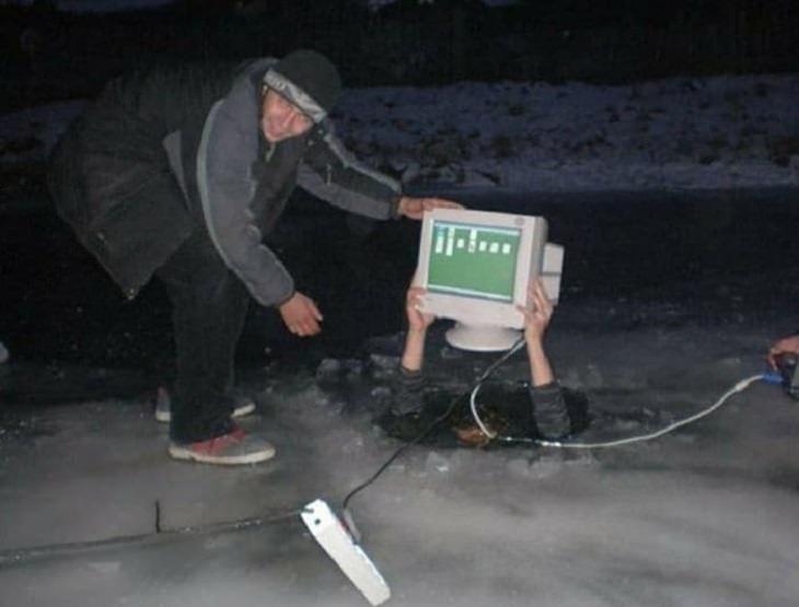 Strange, odd and weird things only found in Russia, men pulling a computer through a hole in the ground