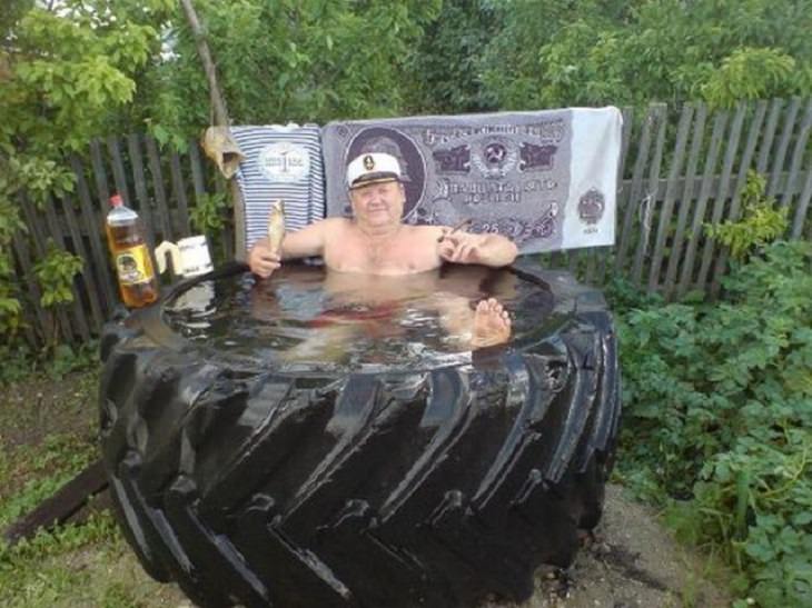 Strange, odd and weird things only found in Russia, man using a giant tire as a bathtub / jacuzzi