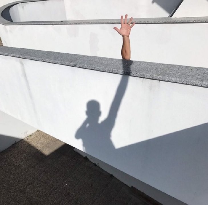 Incredible optical illusions created by Artist and photographer from Portugal Tiago Silva, shadow and hand creating the illusion of an extra long hand