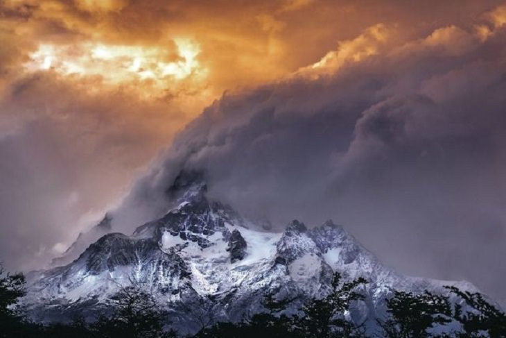 Winners of the Nature Conservancy World wide Photo Competition / Contest, Landscapes, Honorable Mention: Carlos Eduardo Goulart PAINE GRANDE IN THE STORM: A storm forms over the Torres Del Paine National Park in Chile