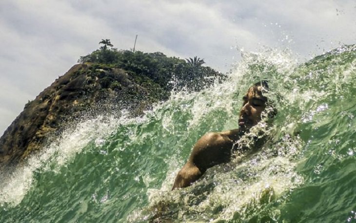 Winners of the Nature Conservancy World wide Photo Competition / Contest, People in Nature, Honorable Mention: Ted Somerville, United States COPACABANA SURFER: A surfer in Copacabana feeling the wave