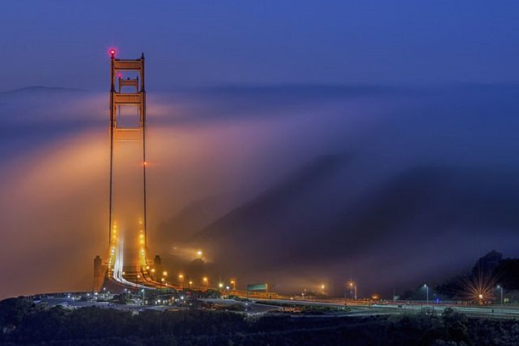 Winners of the Nature Conservancy World wide Photo Competition / Contest, Cities and Nature, First Place: Jay Huang, United States GOLDEN GATE BRIDGE ALIGNMENT: San Francisco’s Golden Gate Bridge as seen from a directly ahead during a low fog event