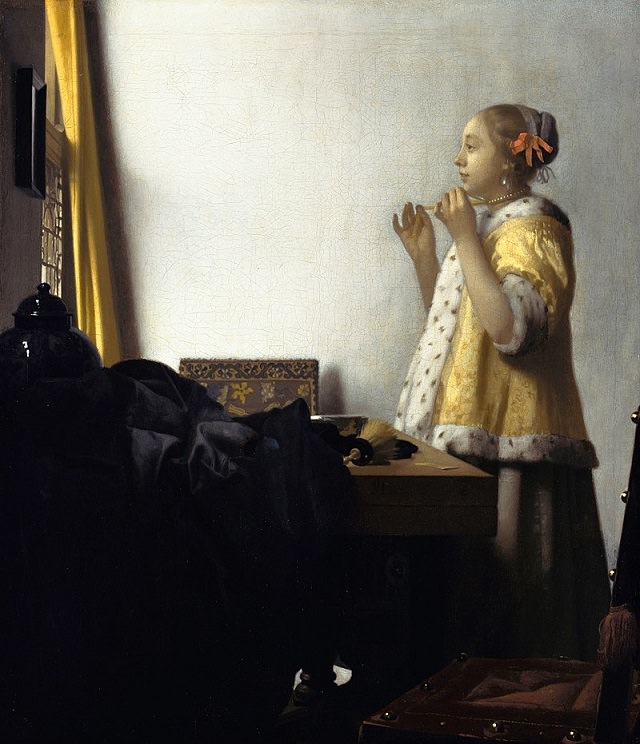 Beautiful lesser known paintings by golden age Dutch artist Johannes Vermeer, Woman with a Pearl Necklace, now in the Gemäldegalerie, Berlin