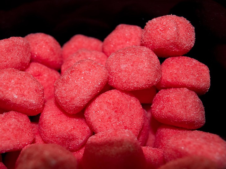 candies, sweets, chocolates and confectioneries from around the world with unique flavors and ingredients, Fraise Tagada, inflated strawberry gummies coated in sugar created by German company Haribo and popular in France