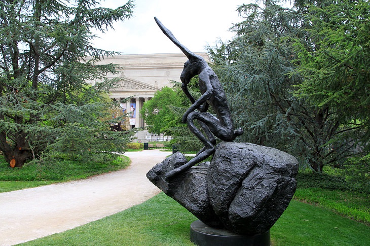 buildings, monuments, memorials and gardens from the National Mall and Memorial Parks in Washington DC, Thinker on a Rock by Barry Flanagan, 1997, in the National Gallery of Art Sculpture Garden