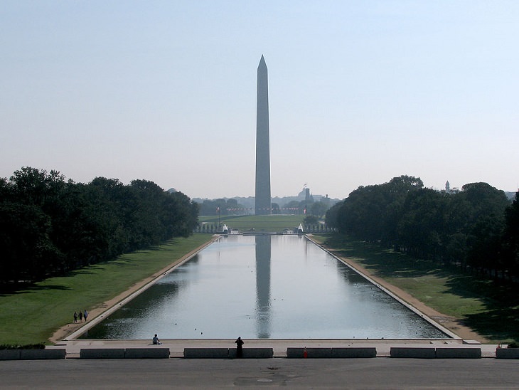 buildings, monuments, memorials and gardens from the National Mall and Memorial Parks in Washington DC, At the foot of the steps of the Lincoln Memorial is the Lincoln Memorial Reflecting Pool, facing the Washington Monument