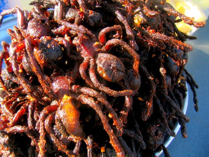Strange, weird, odd and unusual foods, recipes and ingredients from different countries around the world, Fried Spiders, a common regional snacks and popular tourist specialty dish in Cambodia