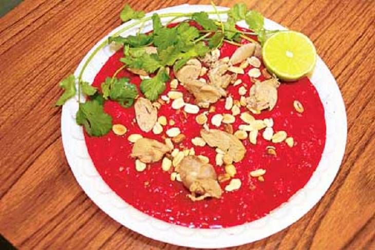 Strange, weird, odd and unusual foods, recipes and ingredients from different countries around the world, Tiet Cahn, a dish from Vietnam that is a raw blood pudding garnished with raw meat either from a duck or a pig