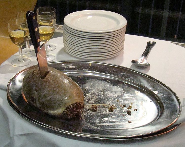 Strange, weird, odd and unusual foods, recipes and ingredients from different countries around the world, Haggis, a well-known savoury pudding from Scotland, made of sheep stomach stuffed with minced heart, liver and lungs