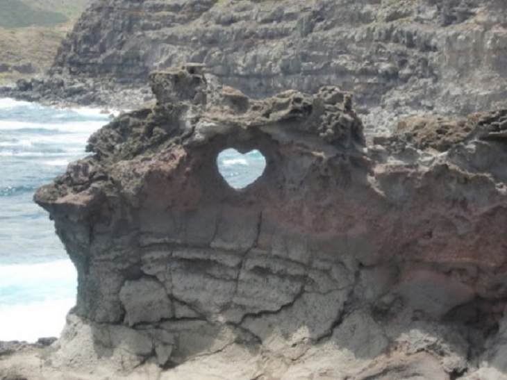 Photographs and pictures of interesting natural phenomenon or well-timed moments that will make you look twice, a heart in a cliff