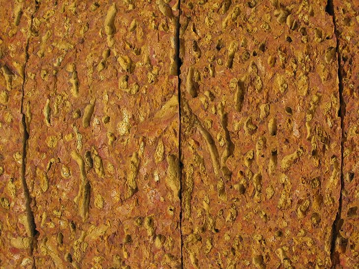Normal or ordinary sedimentary, igneous and metamorphic rocks with beautiful patterns and colors, Laterite, a rust-color sedimentary rock found in tropical areas and used for building monuments