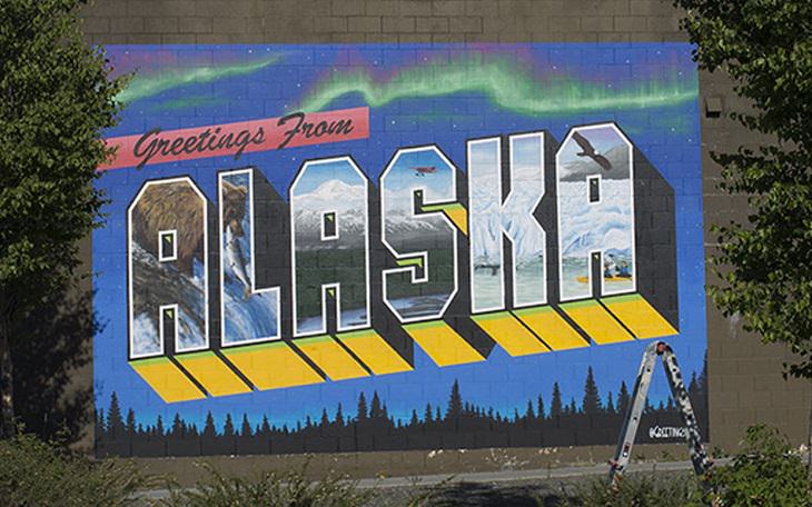 The best and most beautiful street art murals in all states across the United States of America, that send messages of culture, history and community, Alaska, Anchorage, Greetings from Alaska, by Victor Ving and Lisa Beggs