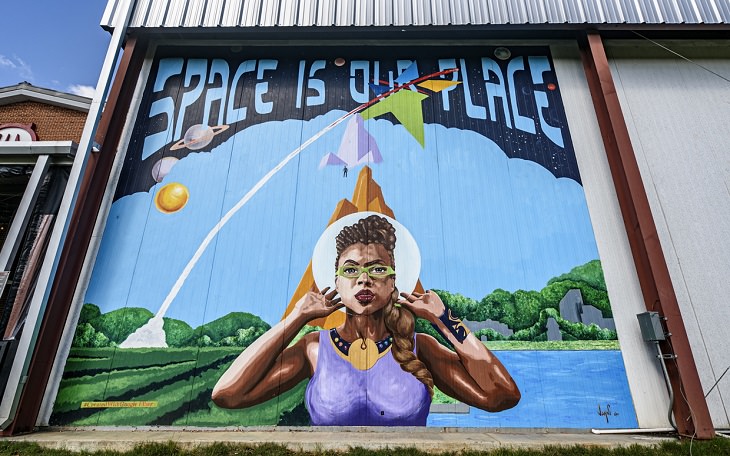 The best and most beautiful street art murals in all states across the United States of America, that send messages of culture, history and community, Alabama, Huntsville, Space is Our Place, by Jahni Moore