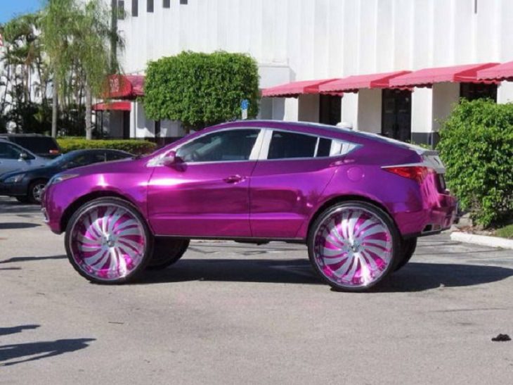 Cars with weird and strange appearances and unique features, purple car with purple monster truck wheels