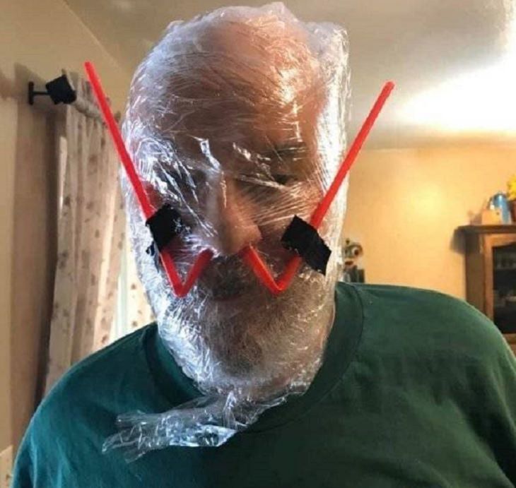 Makeshift and band-aid solutions, DIY quick fixes using common items found all over the house, plastic wrap used to fully cover the face for protection, with straws in the nose for breathing