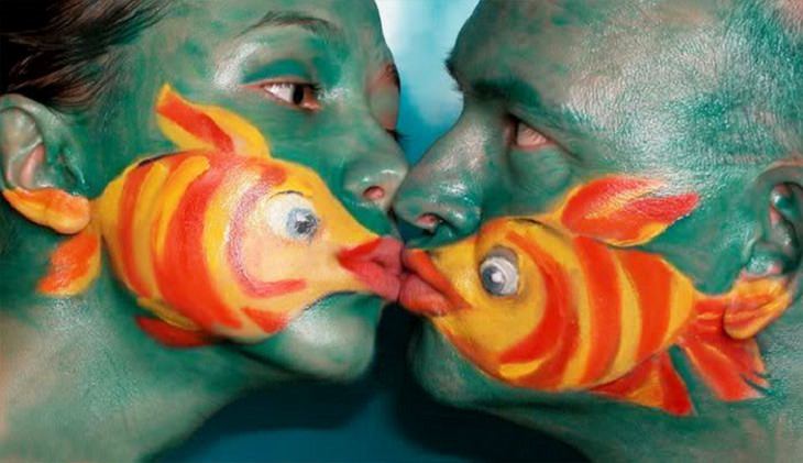 Beautiful works of body art which are painted to give the illusion of things in nature and the world, couple of fish