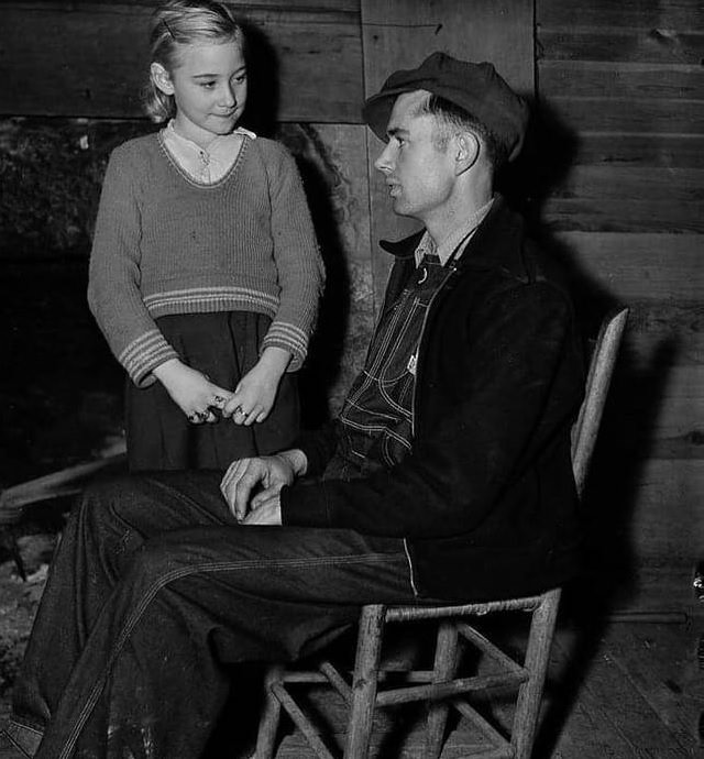 Historic photographs, Eunice Winstead Johns, aged 9 years, and her husband, Charlie Johns, aged 22 years, sit in their home in Tennessee, in 1937