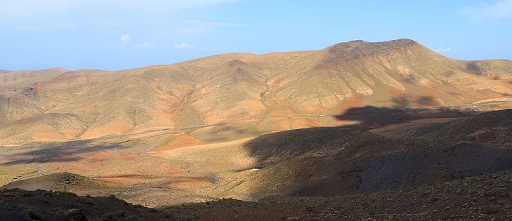 Beautiful sights, beaches, geological formations and cultural activities of Fuerteventura, the oldest and second largest of the Canary Islands, A view of Morro Colorado, from Montaña de Cardón